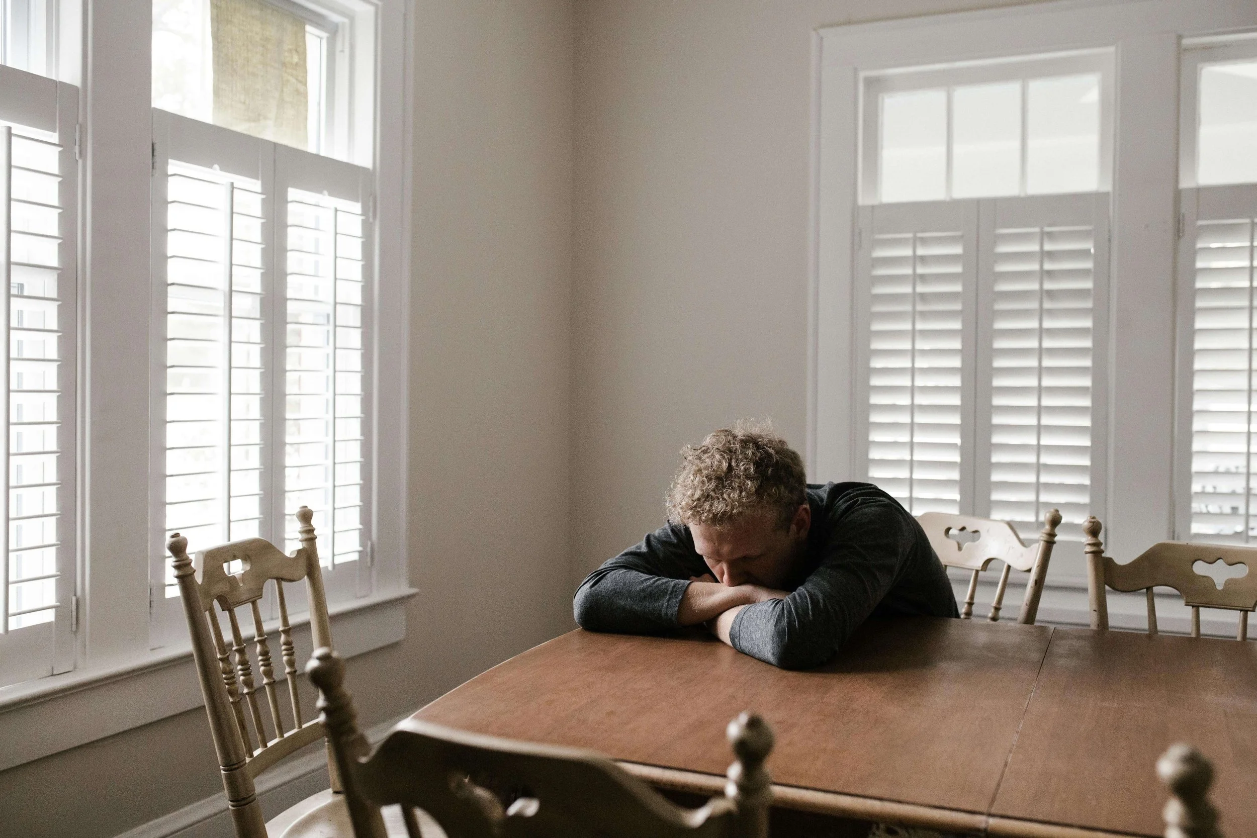 Person at Table - relationship ocd boston ma - rocd boston ma - relationship anxiety boston ma - online therapist boston ma - massachusetts