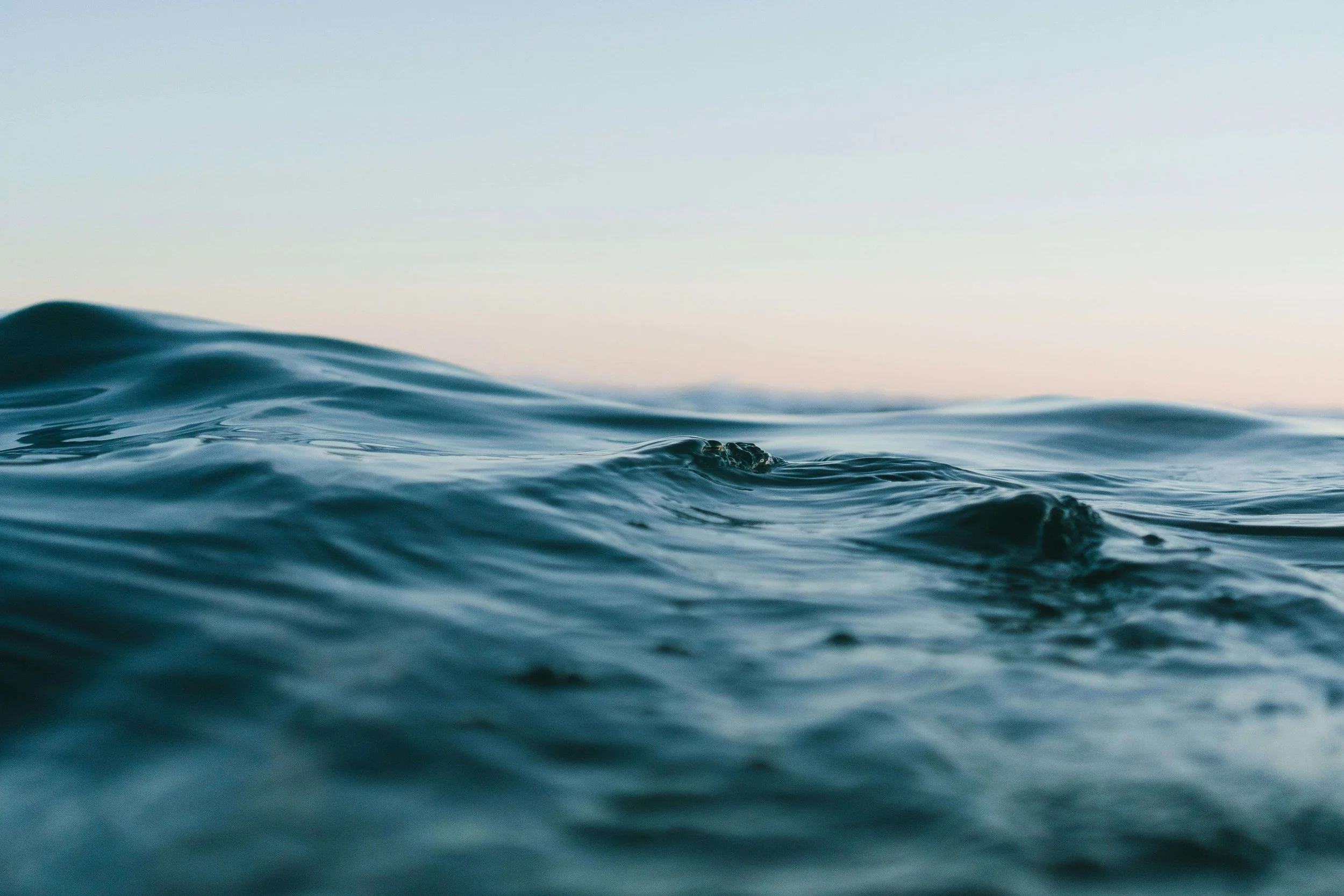 A close-up of an ocean wave. An OCD therapist in Boston, MA is here to support you in learning to ride the wave of anxiety. To learn more, explore the blog here on ERP.