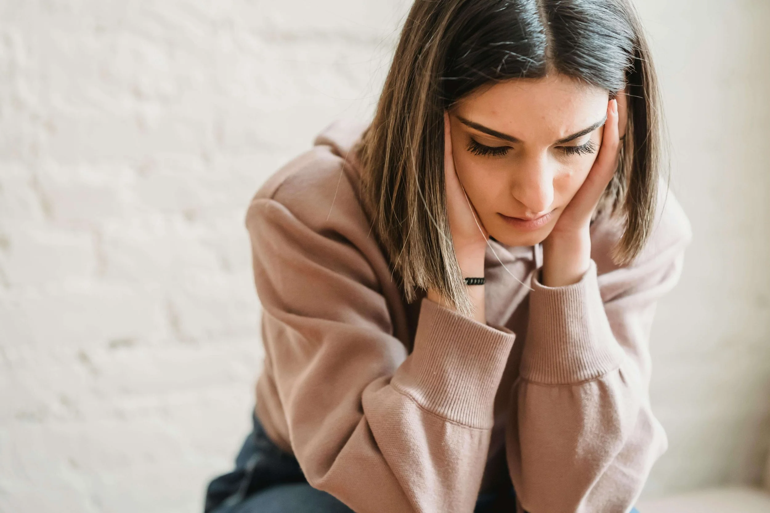 man hunched over outside | ocd counseling boston ma | ocd therapist boston ma | ocd therapy boston, ma | Cambridge, MA | Somerville, MA | Boston, MA
