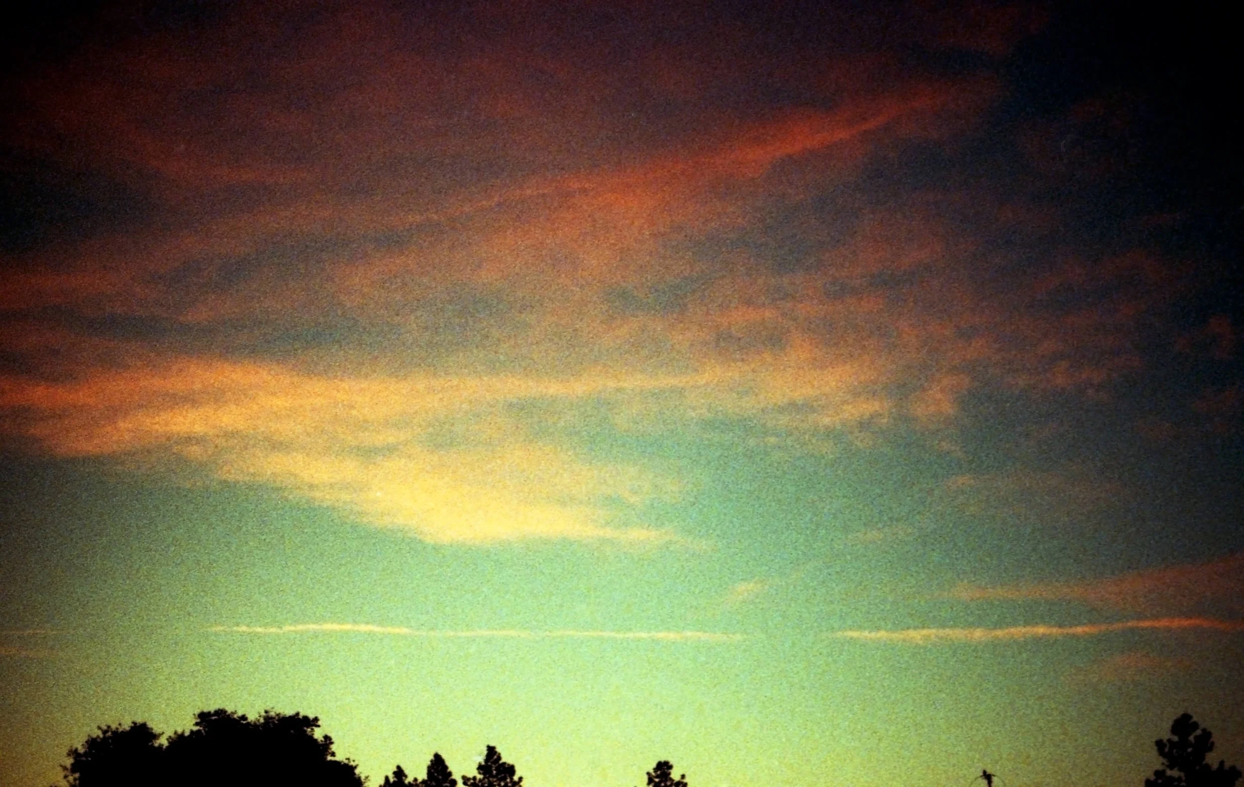 An orange sunset with clouds . Therapy for OCD in Boston, MA is here to support you with managing your OCD thoughts. Learn more here about rumination & overthinking.