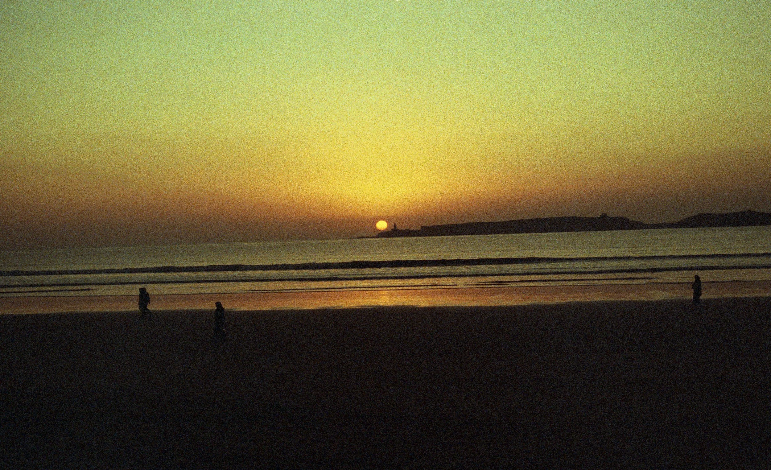 A dark photo of the sun setting on the water. An OCD therapist in Boston, MA can help you understand rumination better. Build a better relationship with your thoughts today.