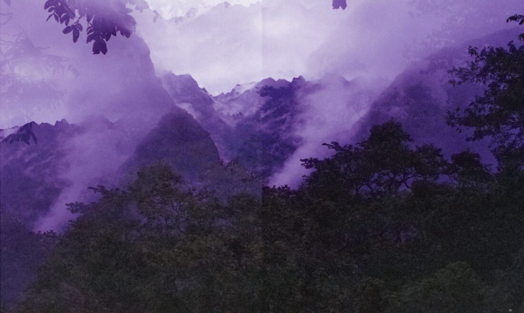 A photo of purple hued mountains near a forest. OCD therapy in Boston, MA is here to support you with overthinking, rumination & anxiety. Learn more here.